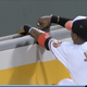 Illustration for article titled Adam Jones Reaches For Home Run, Gets Glove Stuck In Wall